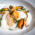 What are some signature seafood dishes at Rebelle?